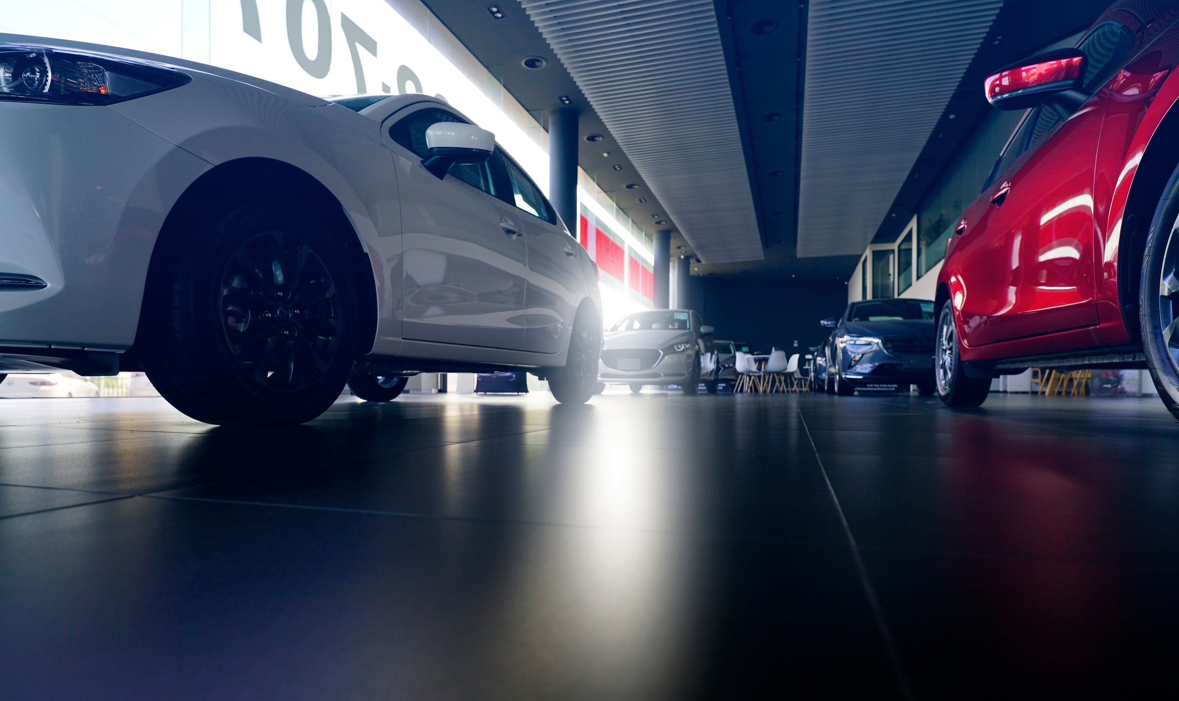 Car parked in luxury showroom. Car dealership office. New car pa